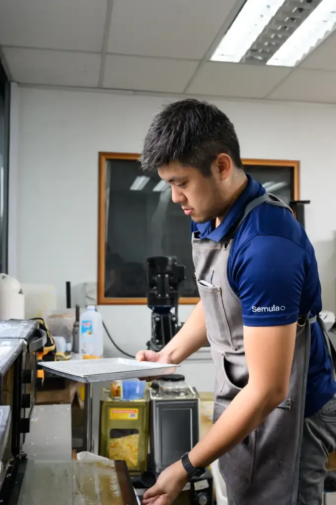 Close-up of the meticulous hand-finishing process, ensuring every Semula product meets high-quality industrial standards.