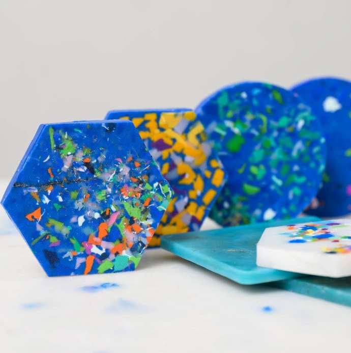 Molten recycled plastic being injected into a precision mould to create durable, high-quality hardware.