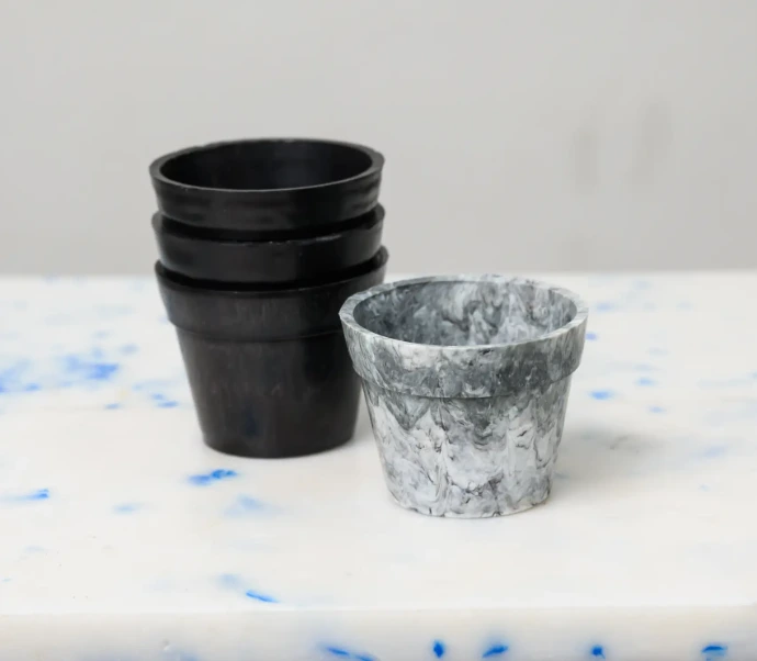 Modern, marbled-finish mini pot made from upcycled plastic, an artistic home for indoor greenery.