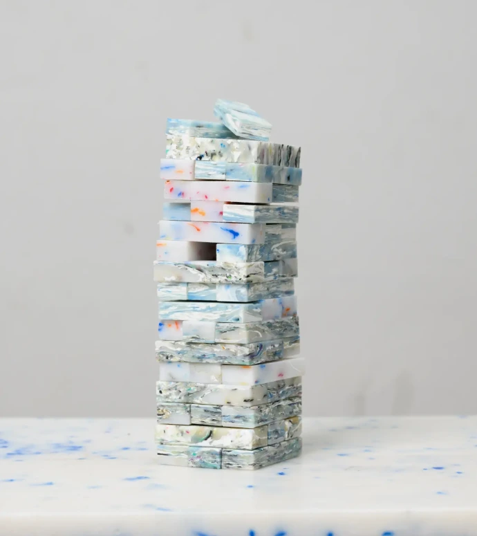 Jenga stackable game pieces made from vibrant, 100% upcycled plastic, ideal for sustainable family play.