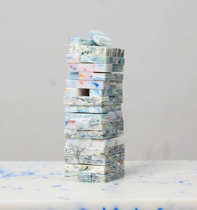 Jenga stackable game pieces made from vibrant, 100% upcycled plastic, ideal for sustainable family play.
